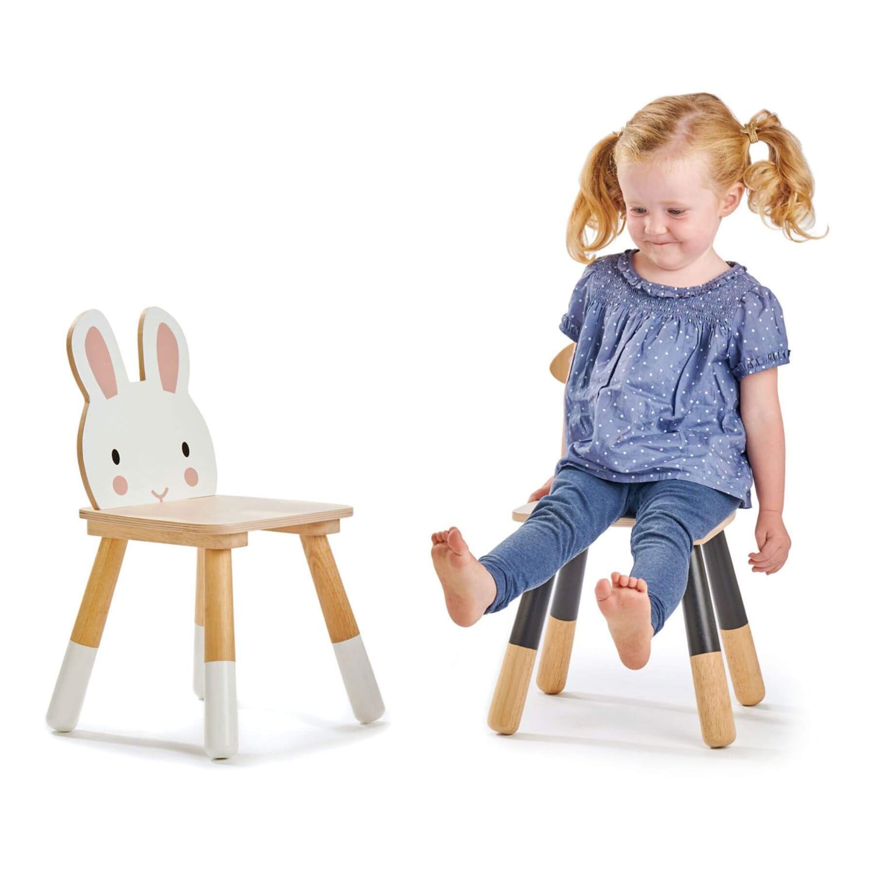 Child sitting on a wooden chair with next to Tender Leaf Forest Rabbit Chair