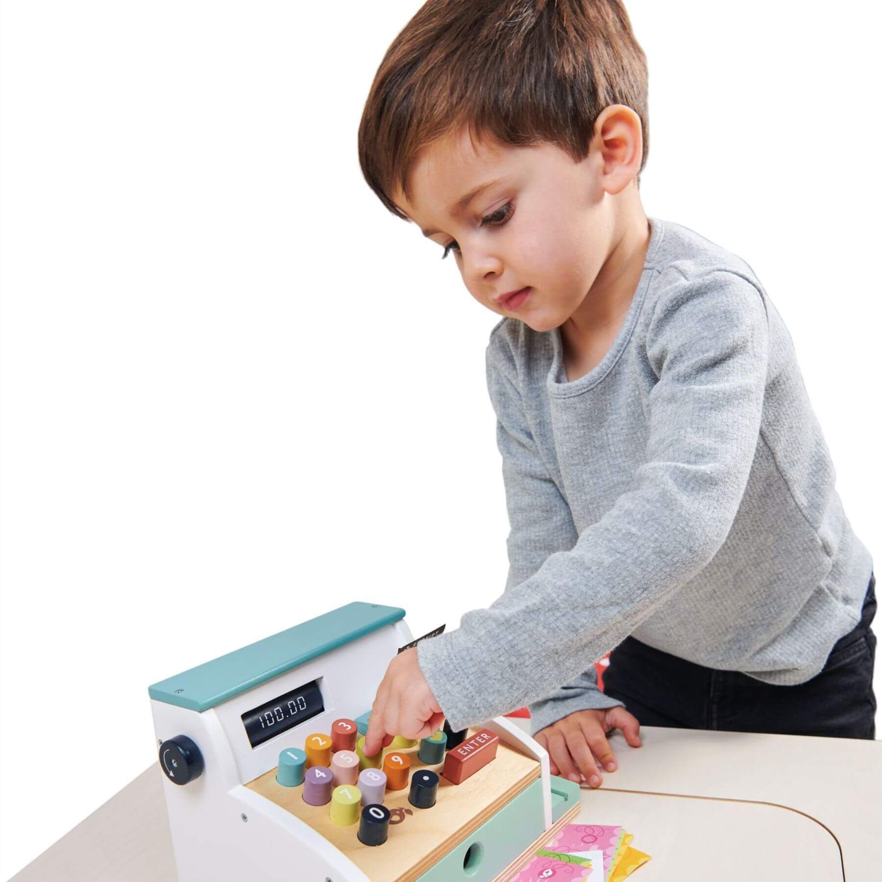 Child playing with Tender Leaf General Stores Till