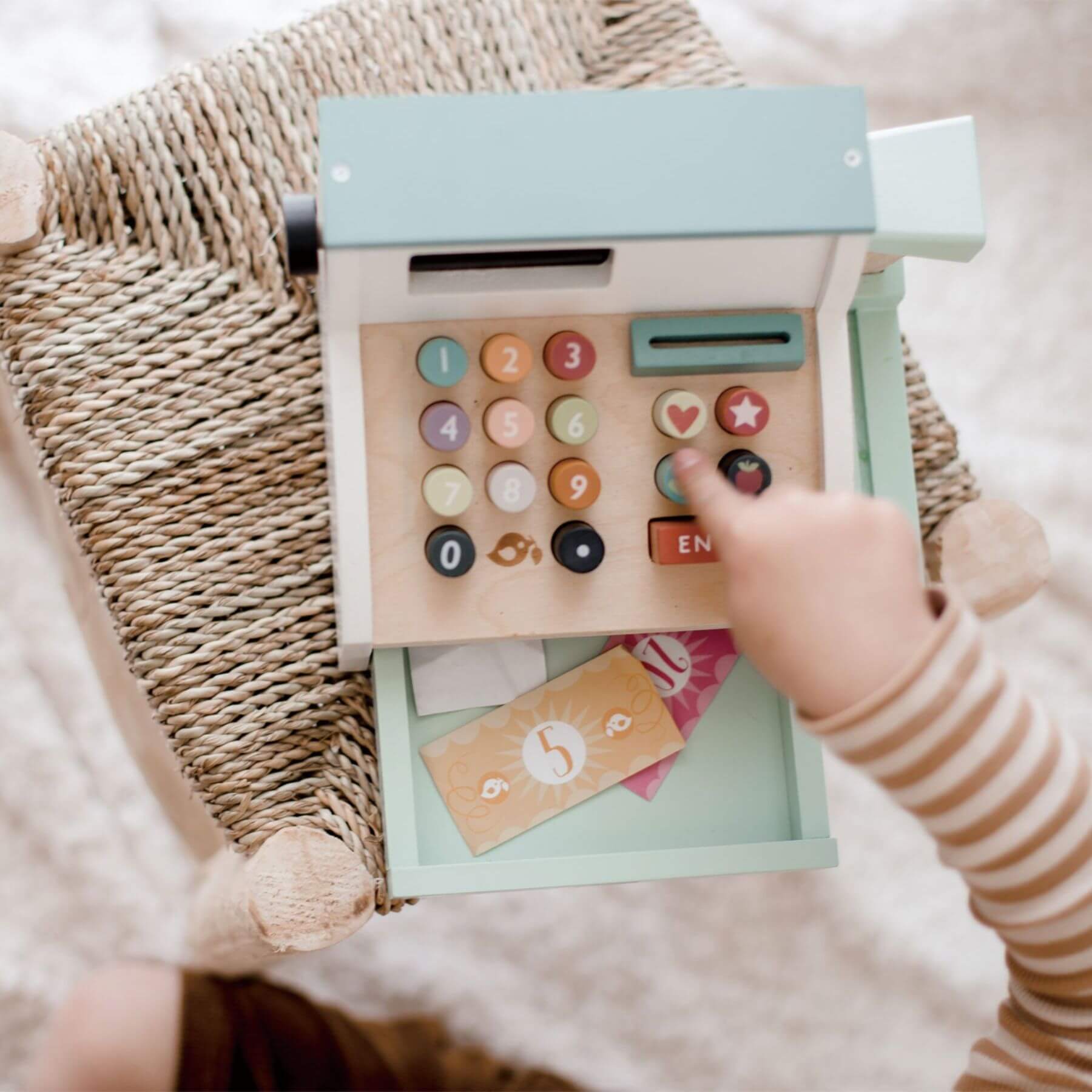 Child playing with Tender Leaf General Stores Till on a soft surface