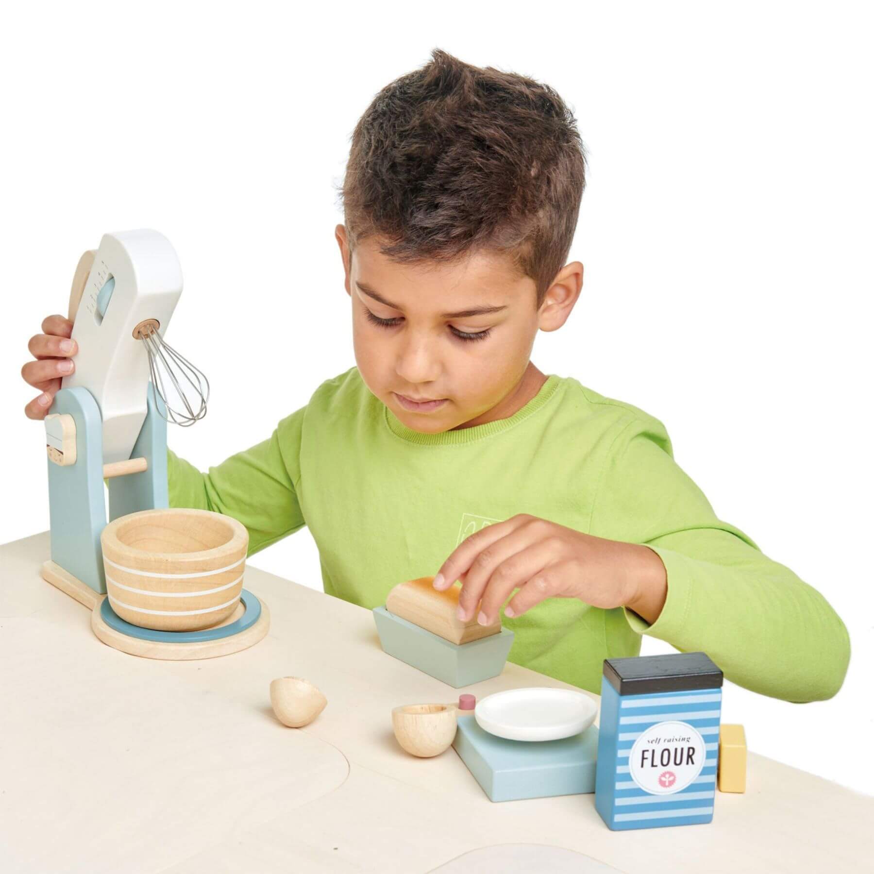 Boy playing with Tender Leaf Home Baking Set
