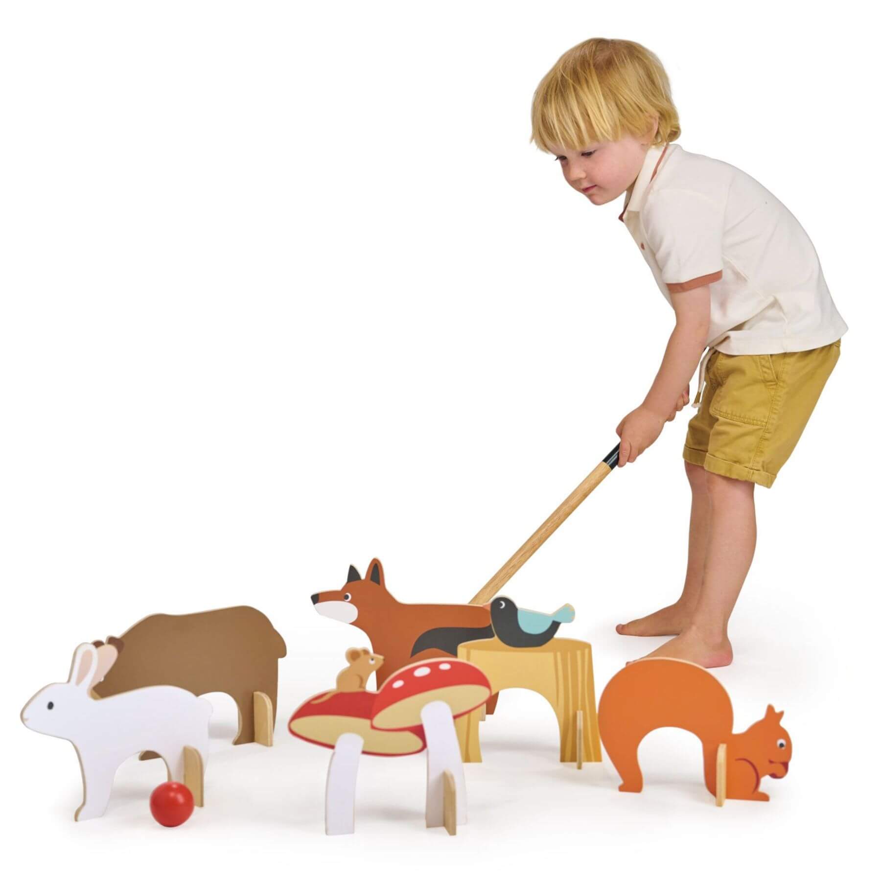 Child playing with Tender Leaf Woodland Indoor Croquet Set