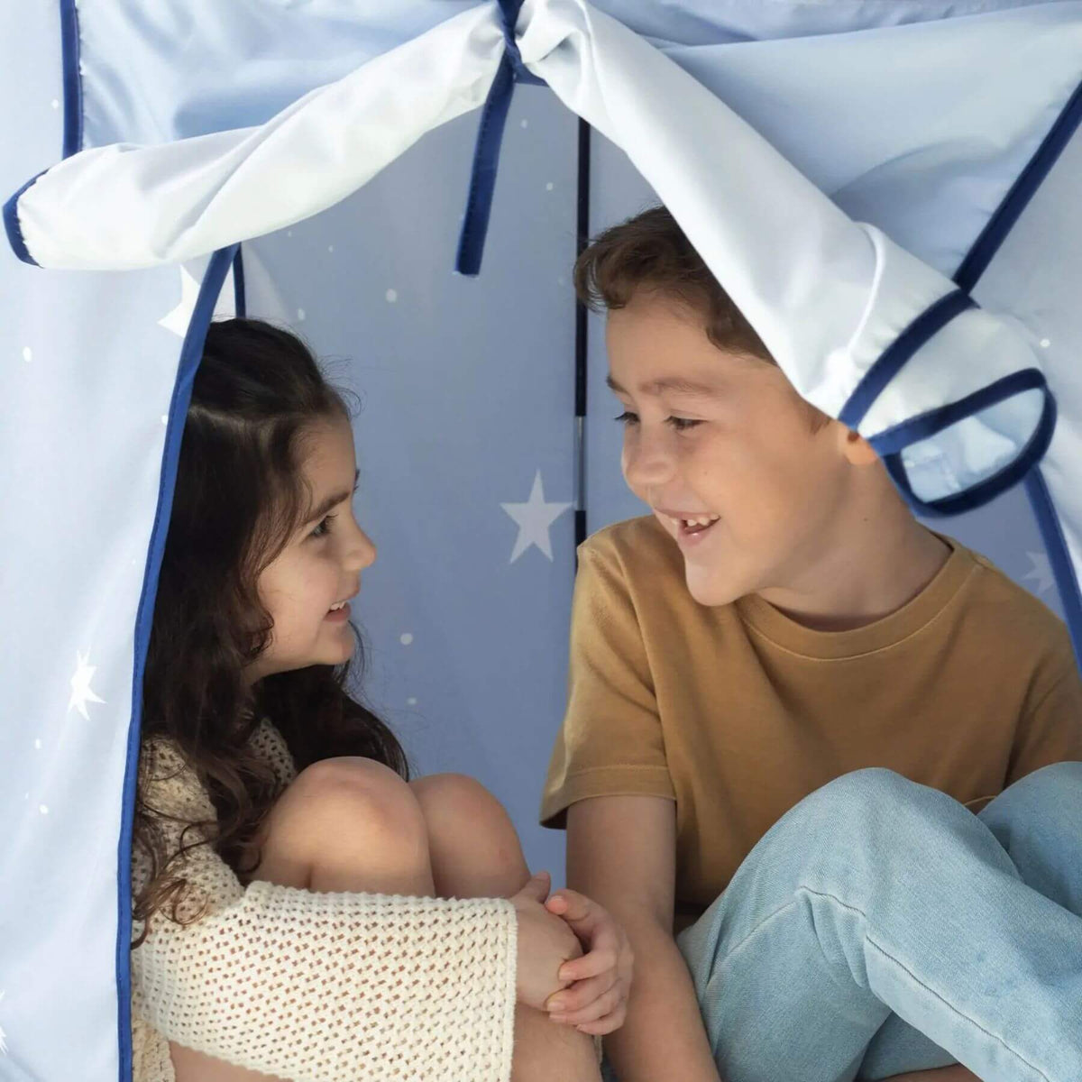 Two children sitting inside Tiny Land® Kids Tent - Blue
