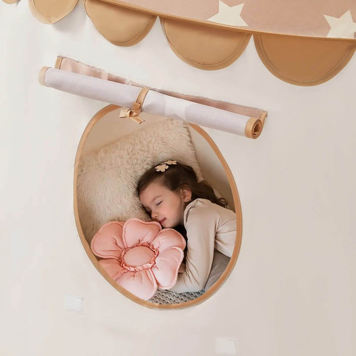 Child sleeping in Tiny Land® Kids Tent - Brown