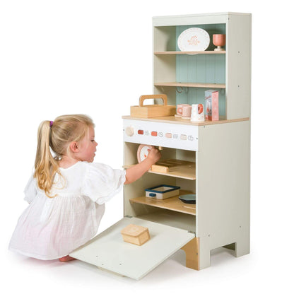 Child playing with Tender Leaf Kitchen Dresser and Dishwasher on a white background