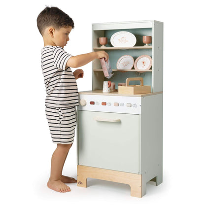 Child playing with Tender Leaf Kitchen Dresser and Dishwasher on a white background