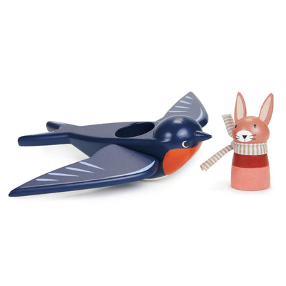 A wooden toy set featuring a swallow-shaped bird with wings and a small rabbit figure wearing a striped scarf, photographed on a clean white background.