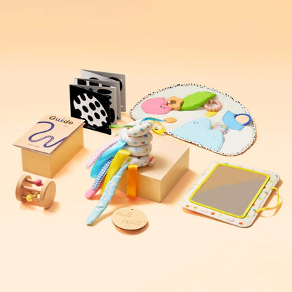 Collection of educational toys and materials on a beige background