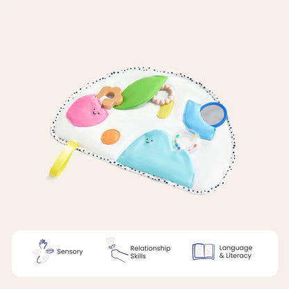 Baby toy with colorful elements on a beige background