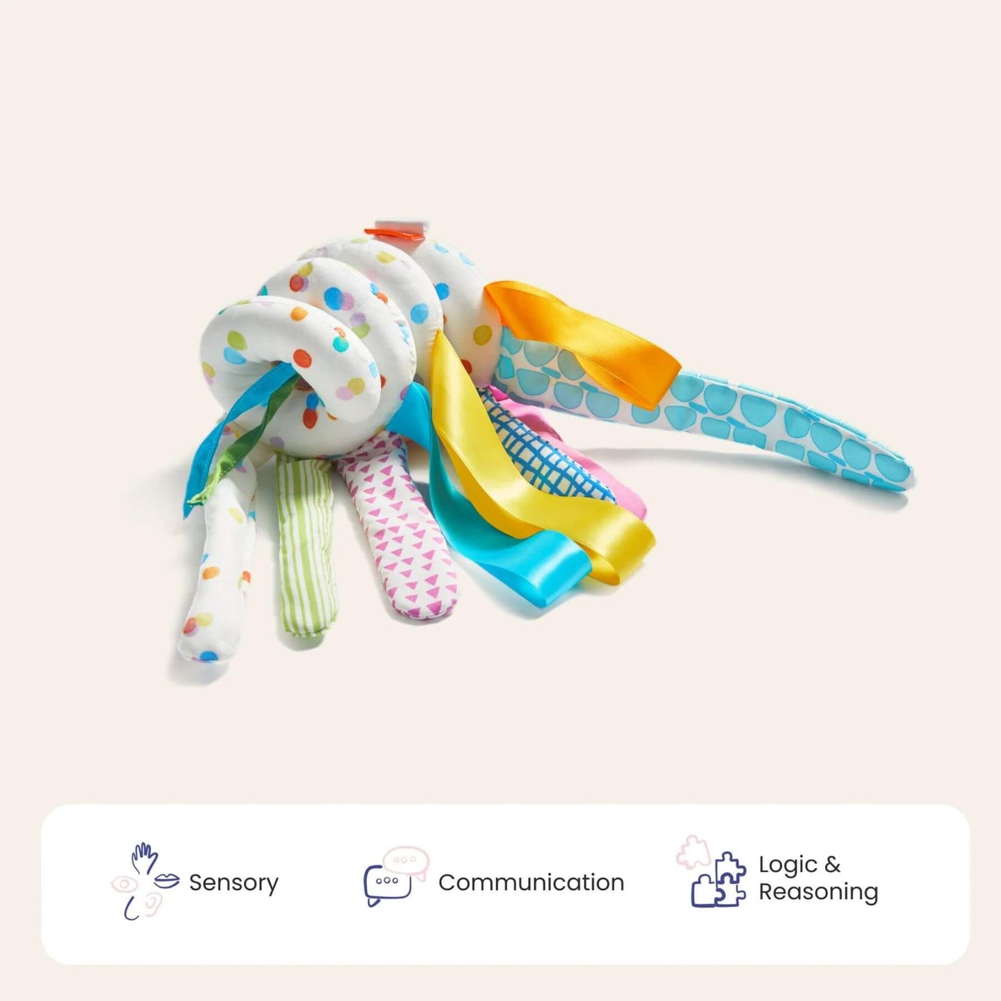 Colorful baby rattle toy on a light beige background