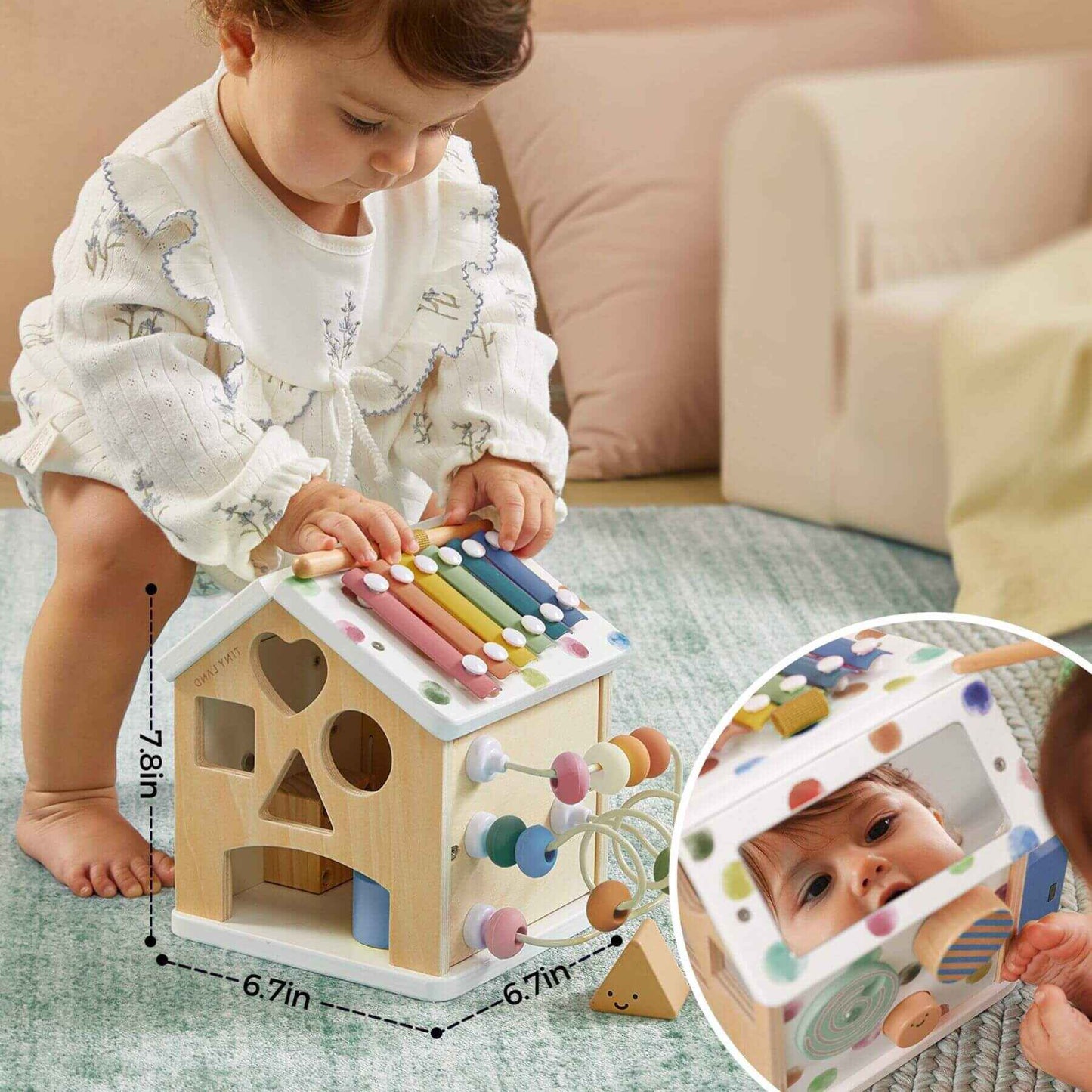 Child playing with Tiny Land® Cottage Activity Cube - Morandi, with inset showing a photo of the child.