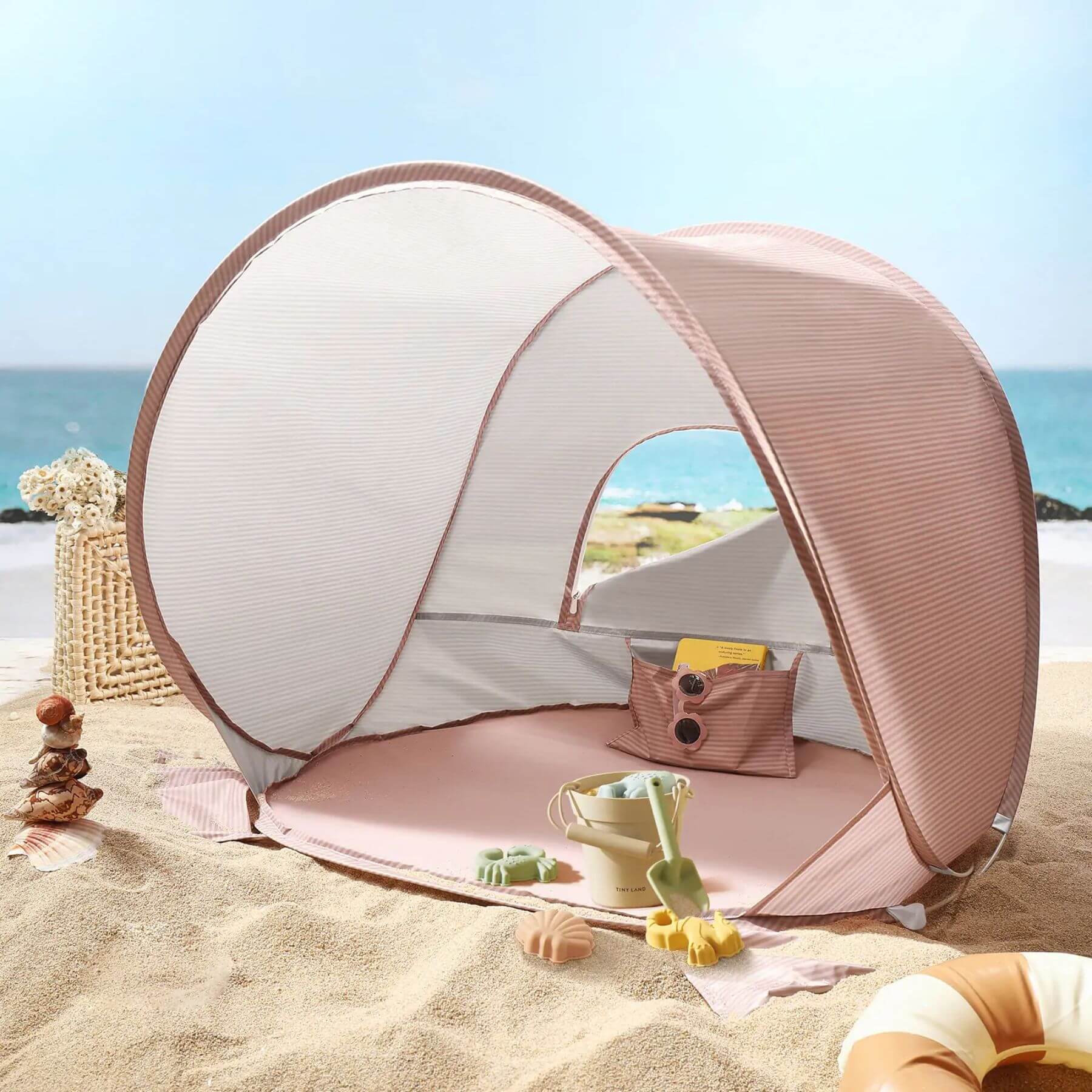 Portable beach tent on a sandy beach with ocean view