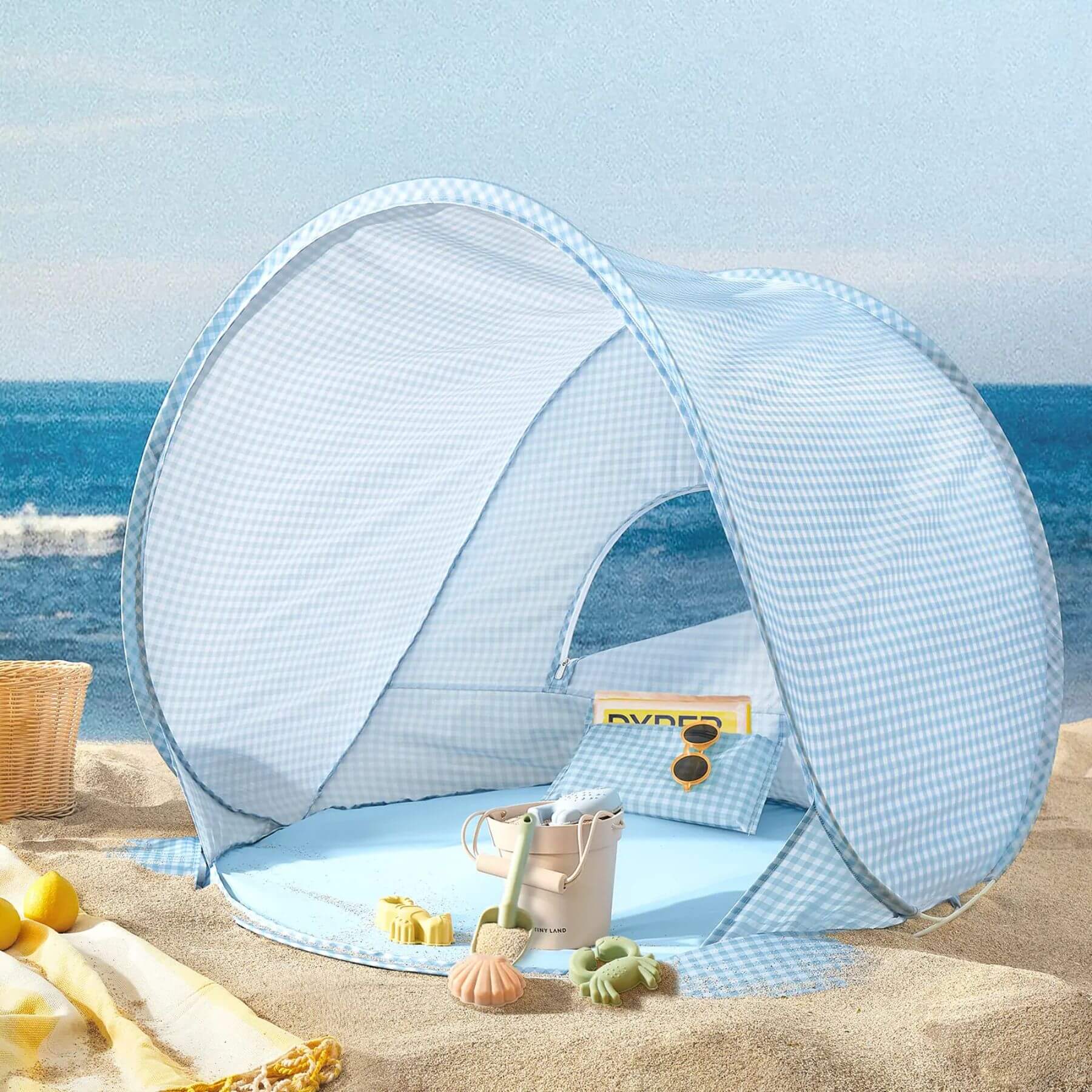 Pop-up beach tent on a sandy beach with ocean view