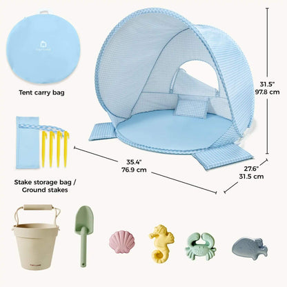 Children's play tent with accessories including a carry bag, ground stakes, and beach toys on a white background.