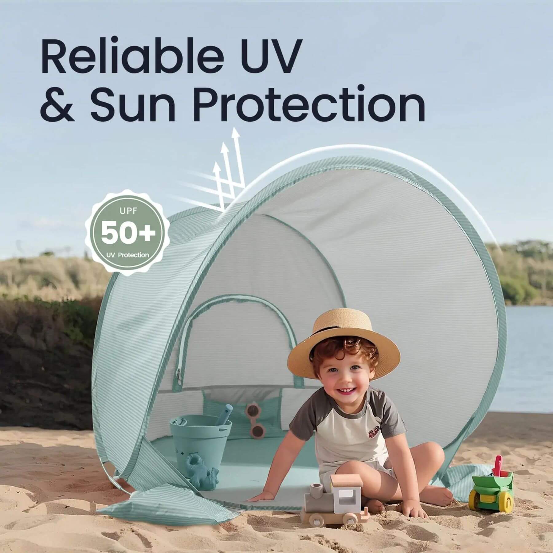 Child sitting under a UV and sun protection tent on a beach with text 'Reliable UV & Sun Protection' and 'UPF 50+'.