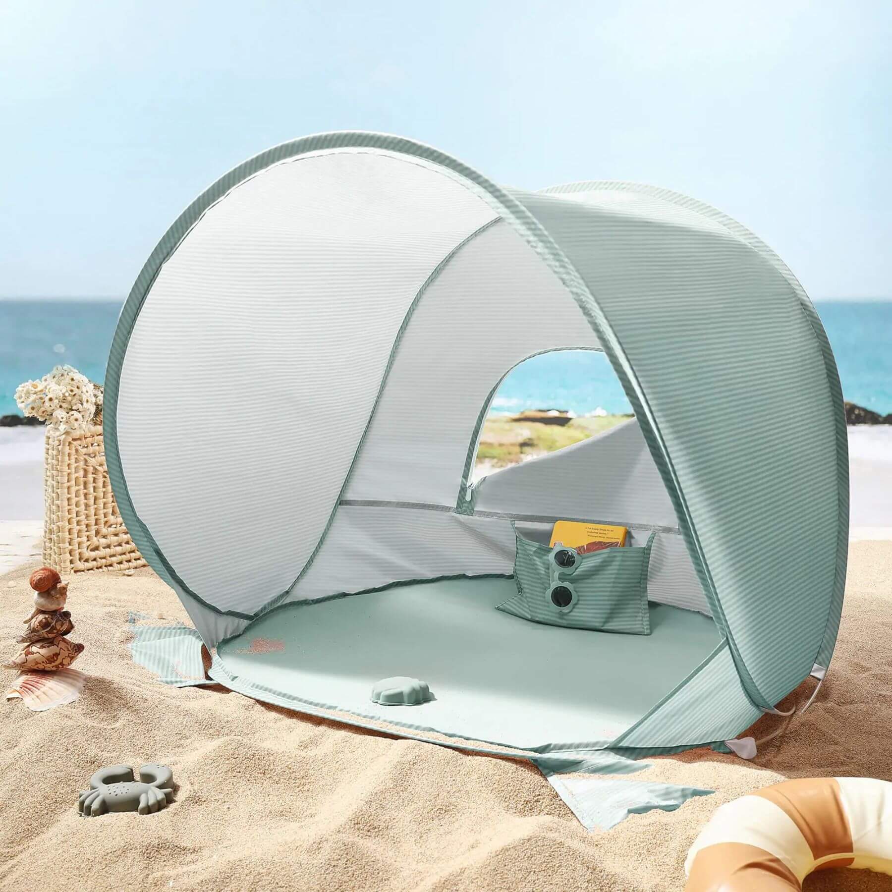 Portable beach tent on a sandy beach with ocean view