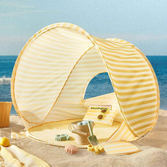 Tiny Land® One-Stop Beach Toy & Tent Set – Pastel Yellow Stripes on a sandy beach with ocean view