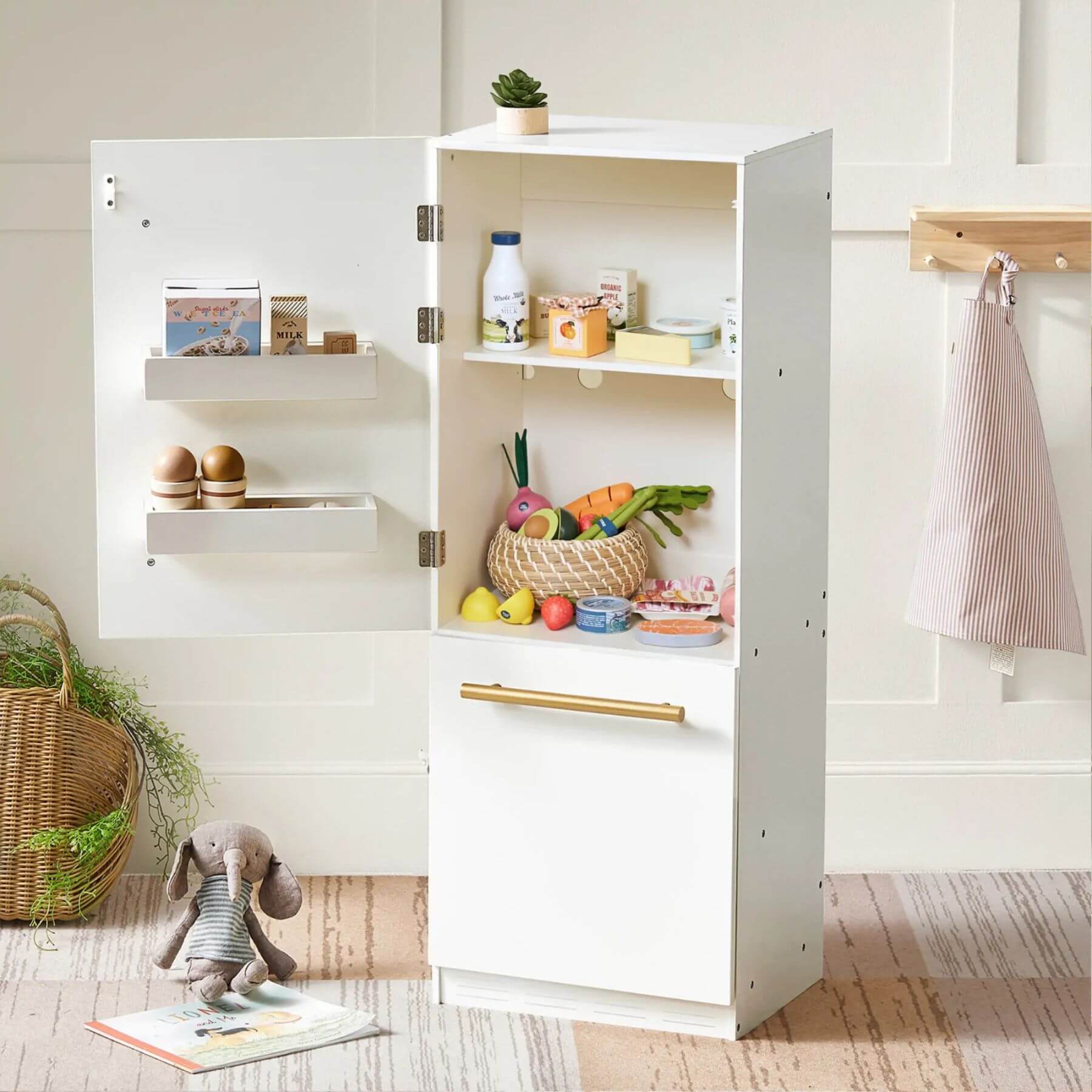 White cabinet with open doors displaying toys and items in a room setting.