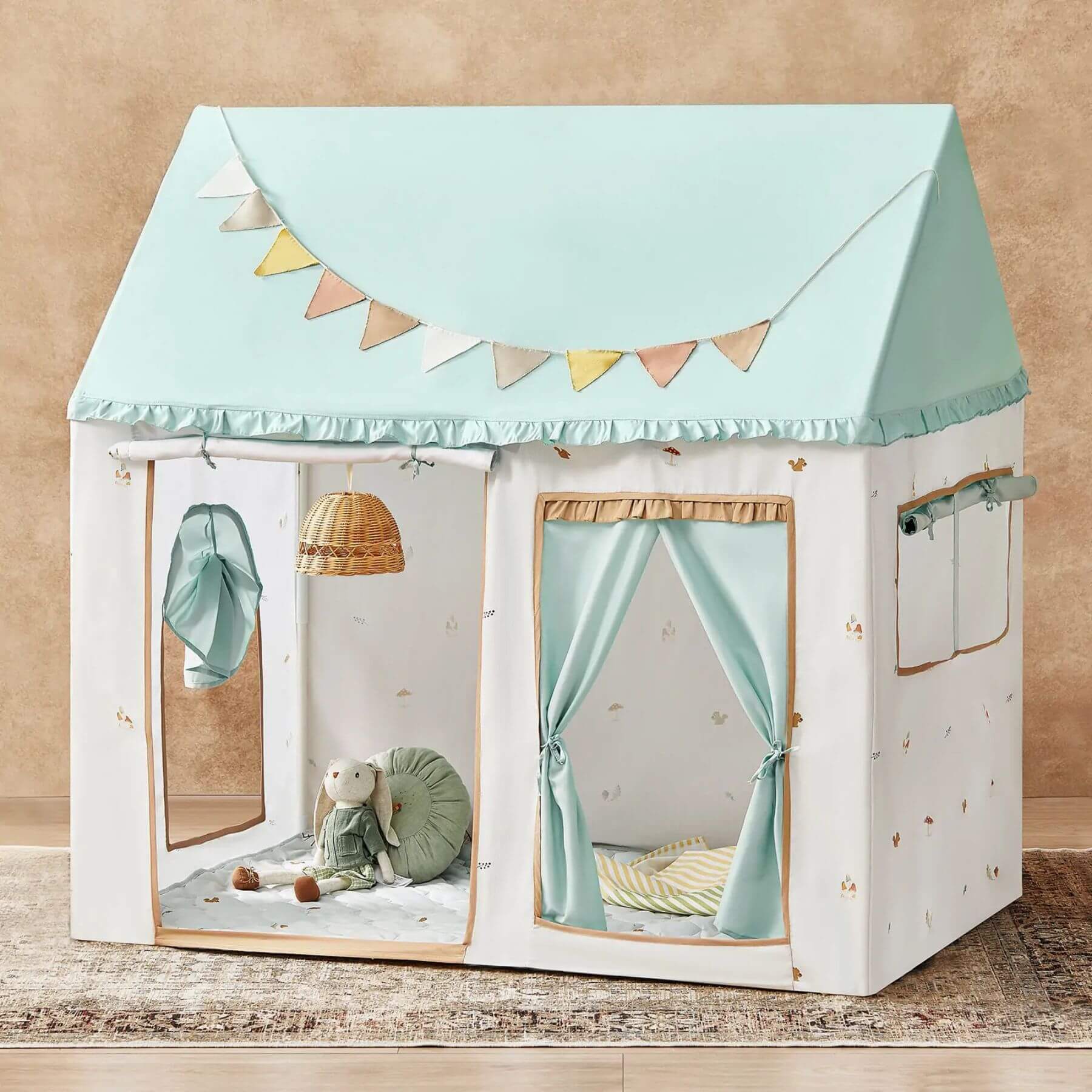 Tiny Land® Playhouse Tent and interior decor on a beige background