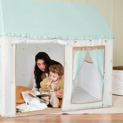 Woman and child inside Tiny Land® Playhouse Tent reading together
