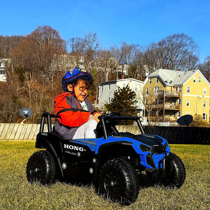 Kid playing Tamco 12V Ride On UTV Toy Electric Car Blue