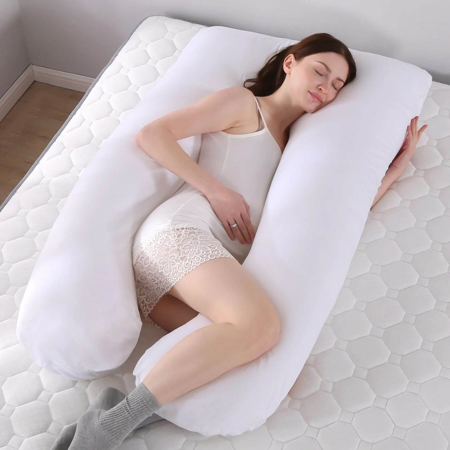 Woman sleeping on RocketBaby USA U-Shaped Multifunctional Maternity Pillow - White