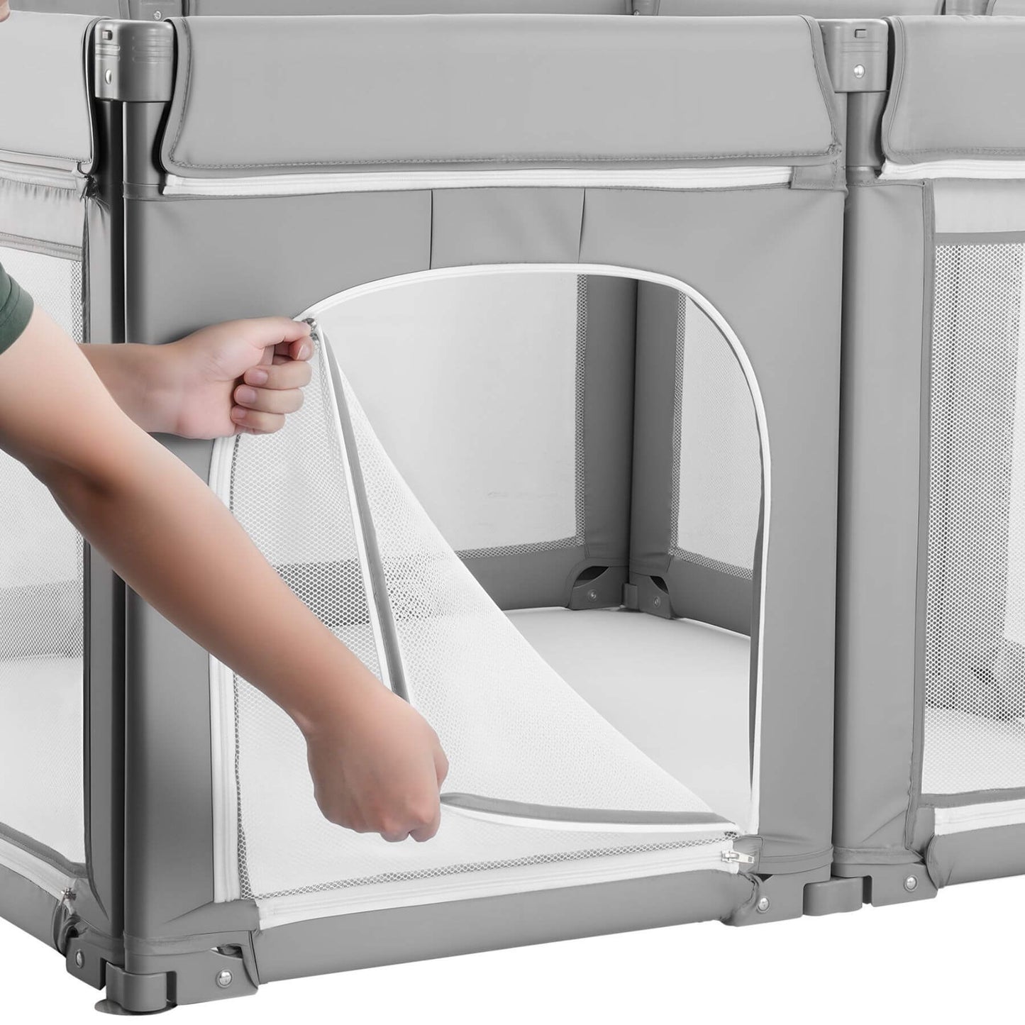 Person adjusting a mesh panel on a gray playpen.