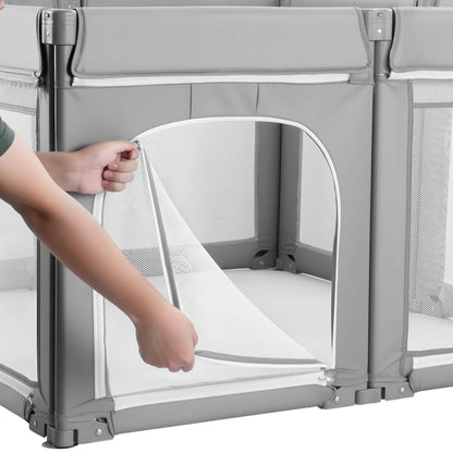 Person adjusting a mesh panel on a gray playpen.