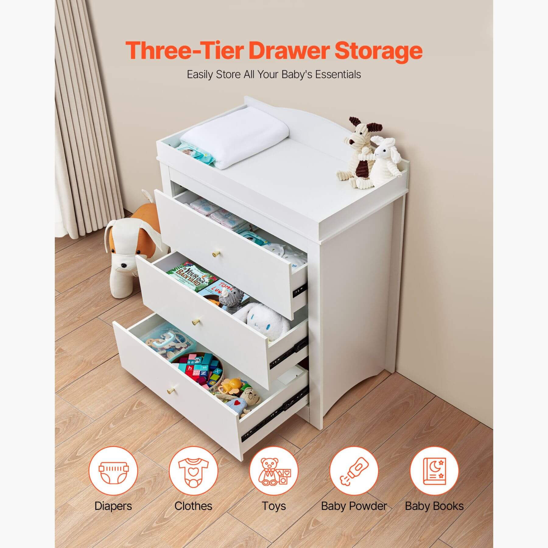 White three-tier drawer storage unit with baby items on a wooden floor.