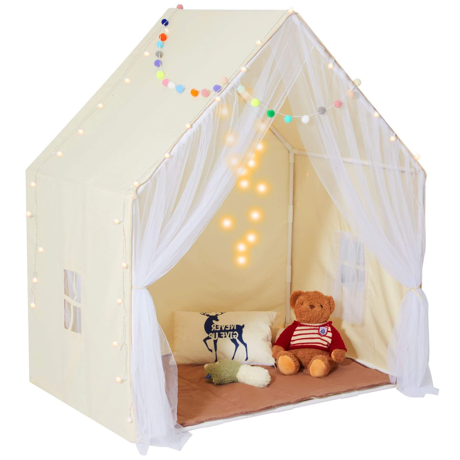 Children's play tent with a teddy bear and pillows inside, decorated with string lights.