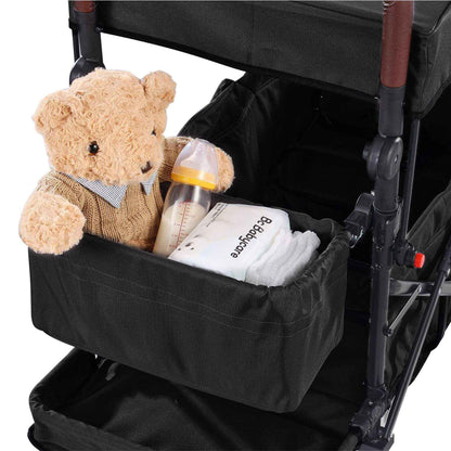 Black stroller organizer with a teddy bear, bottle, and wipes inside.