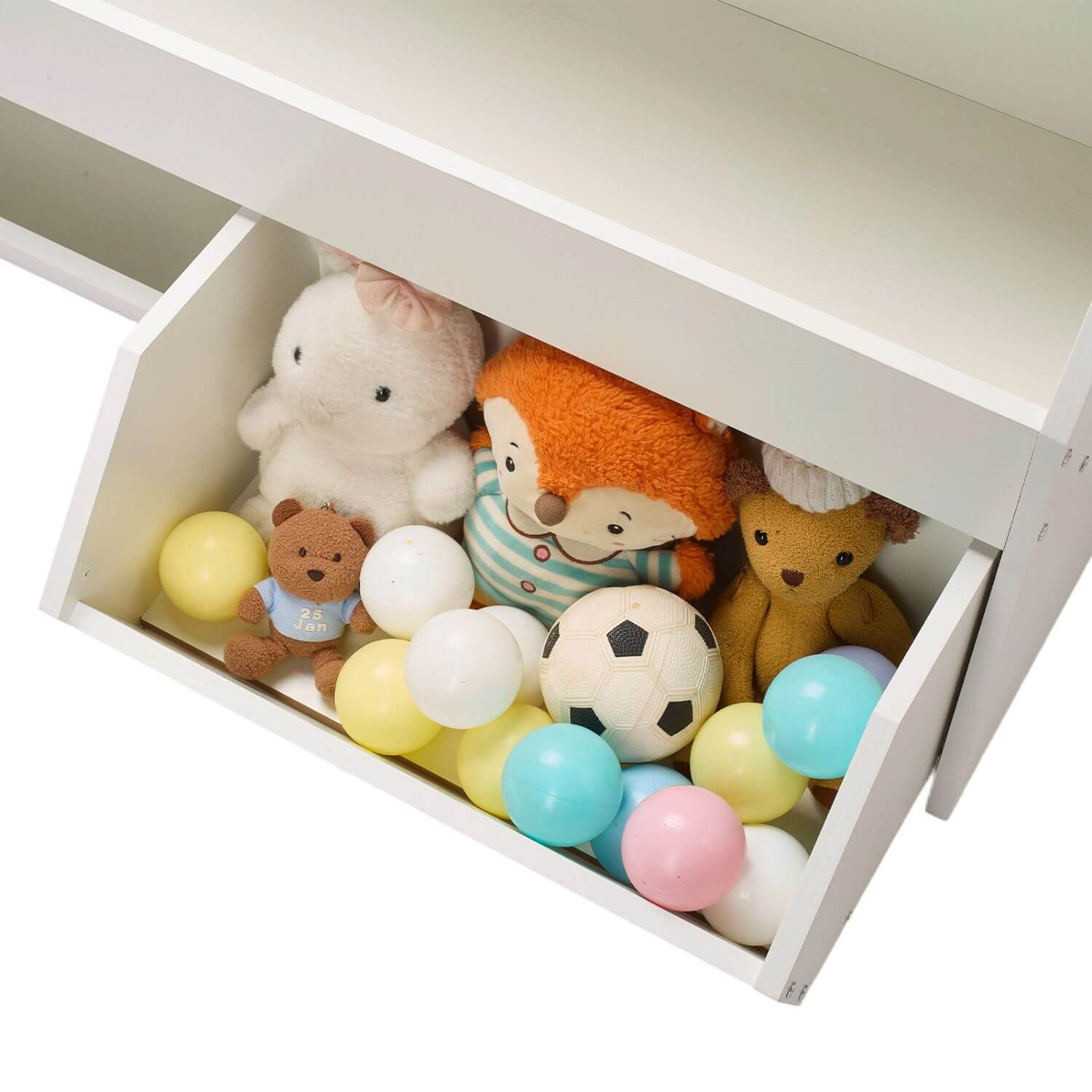 Open white drawer filled with colorful balls and plush toys on a white background