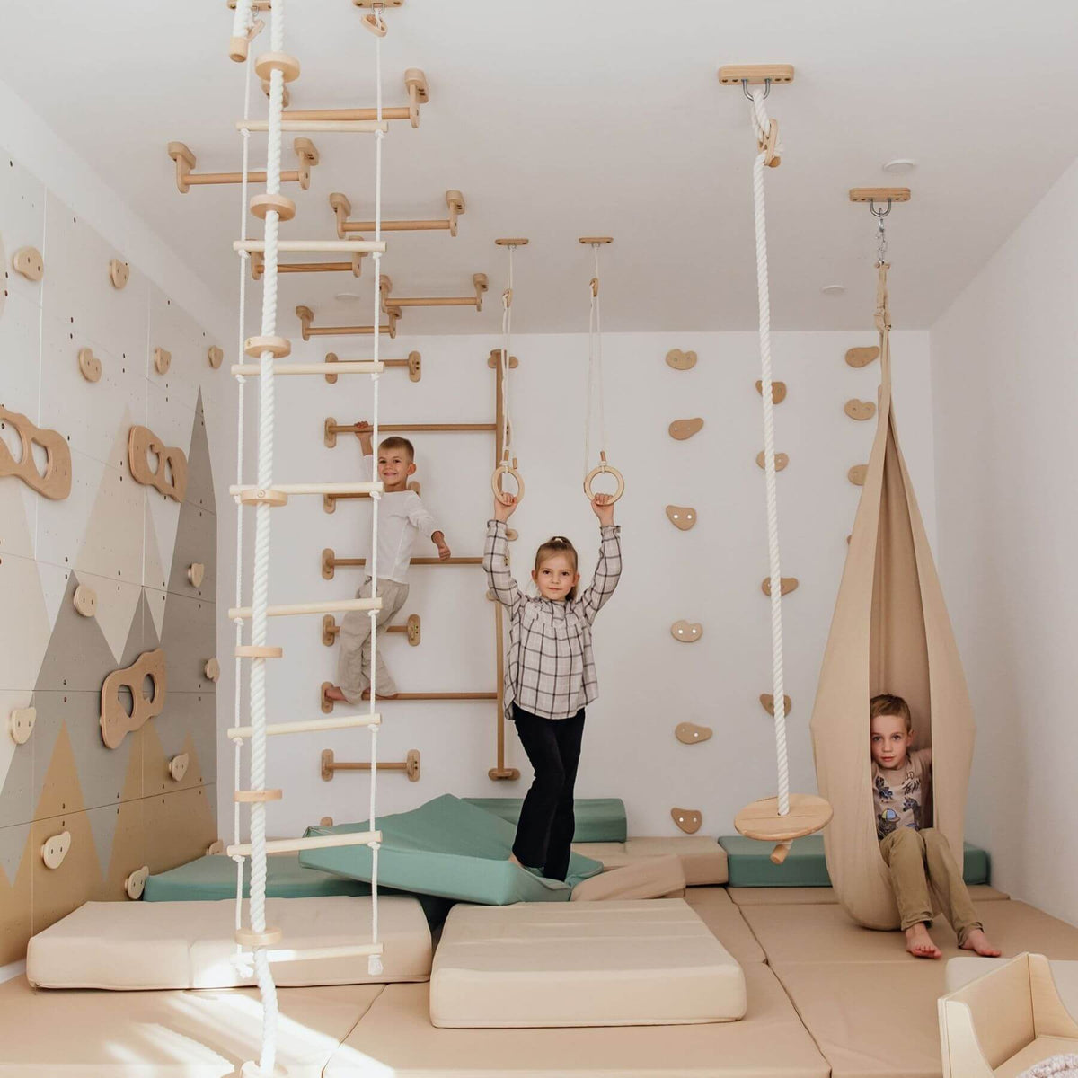 Wood and Hearts Climbing Wall Playground where children are playing.