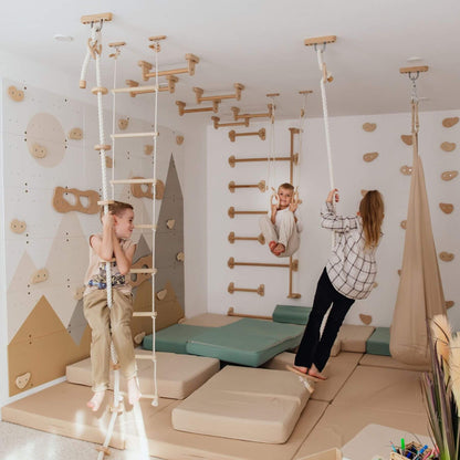 Children playing in a playroom with Wood and Hearts Climbing Wall Playground