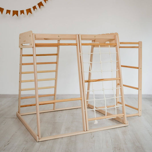 Wood and Hearts Jungle Gym Playset on a light wooden floor.