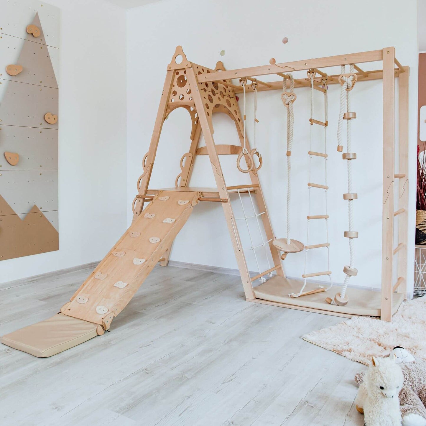 Wood and Hearts Wooden Playground in a room setting.