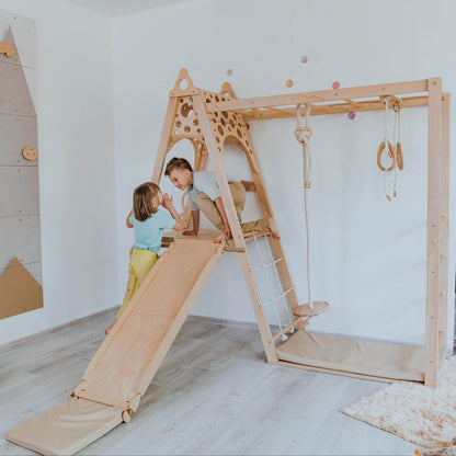 Children playing on Wood and Hearts Wooden Playground in a room.
