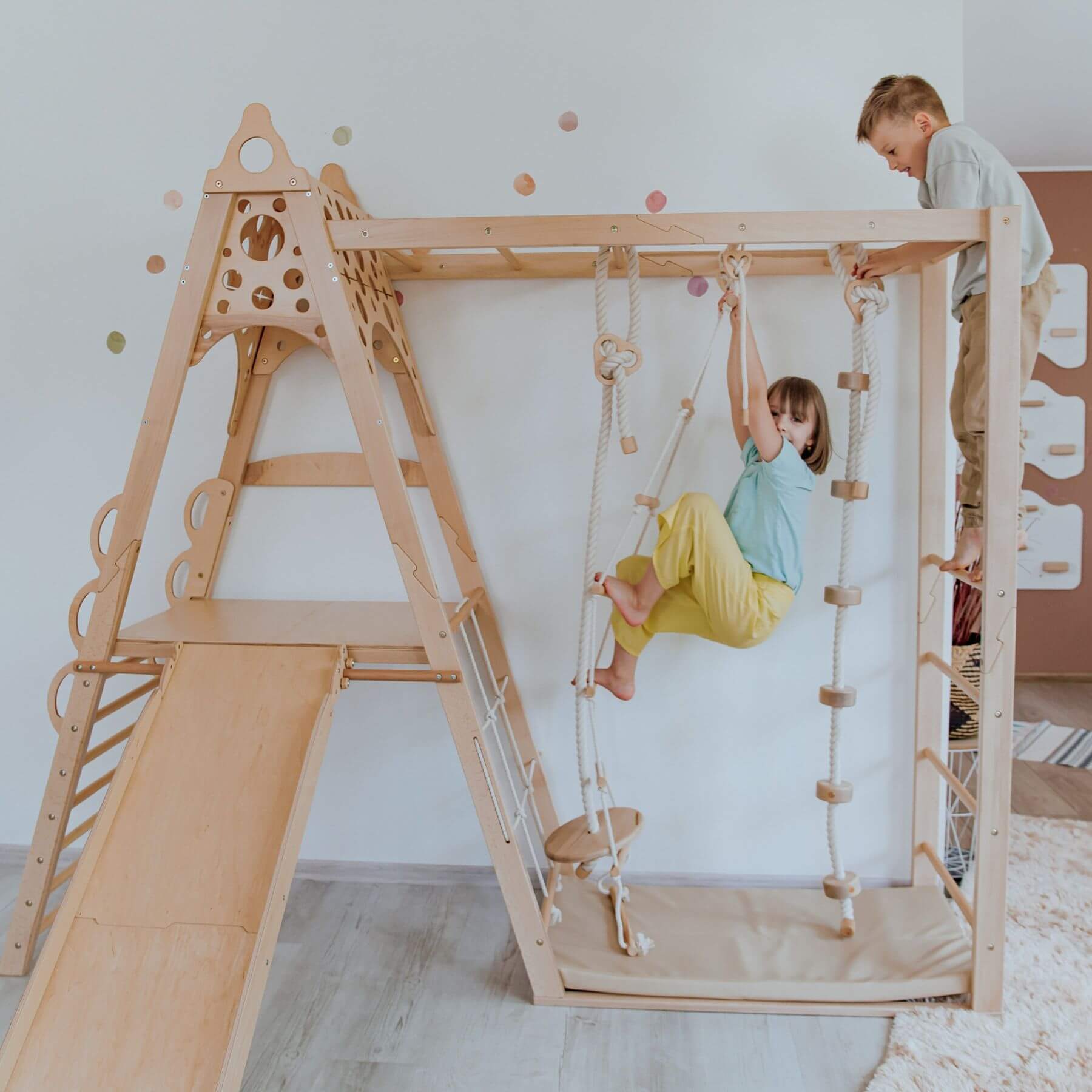 Children playing on Wood and Hearts Wooden Playground.