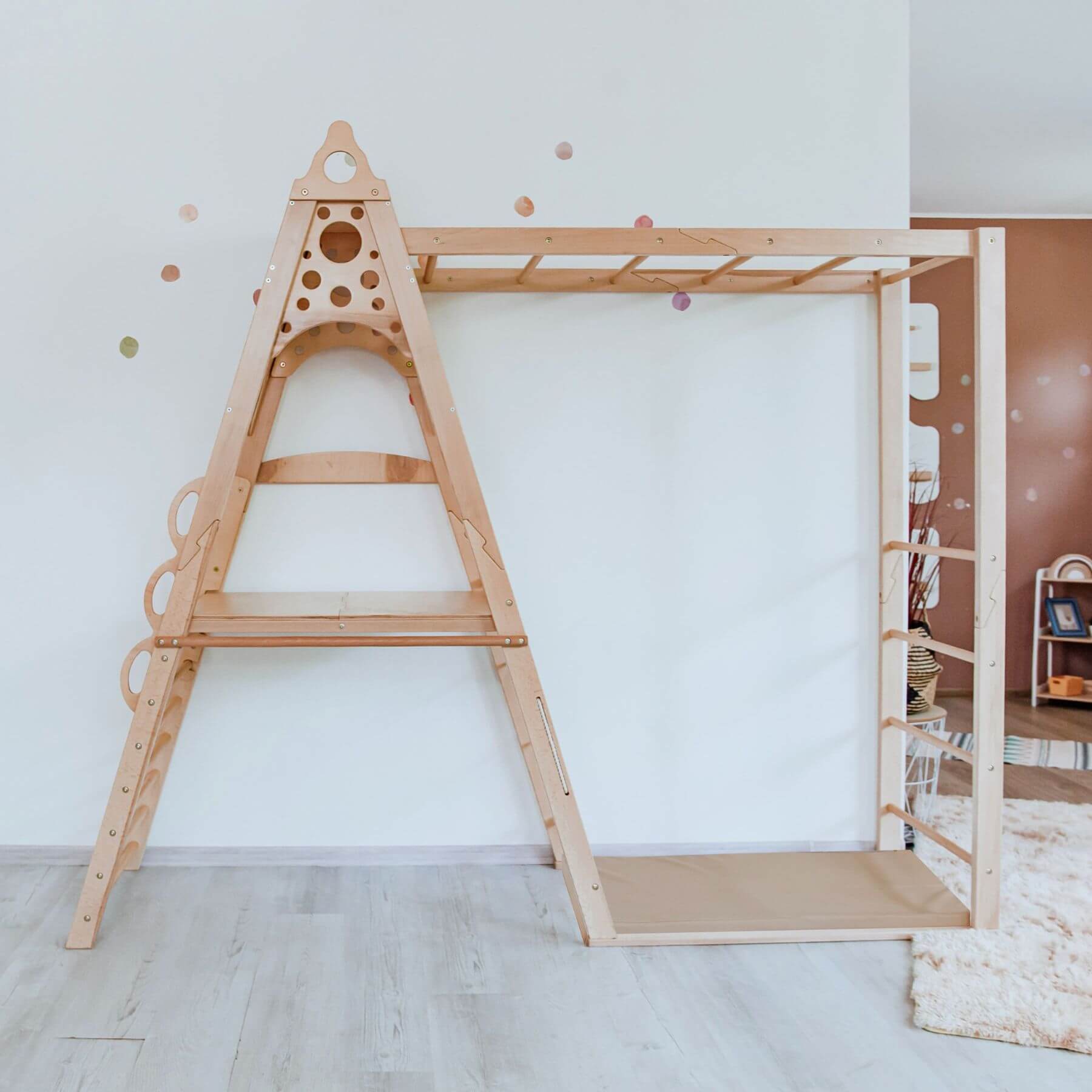 Wood and Hearts Wooden Playground against a white wall