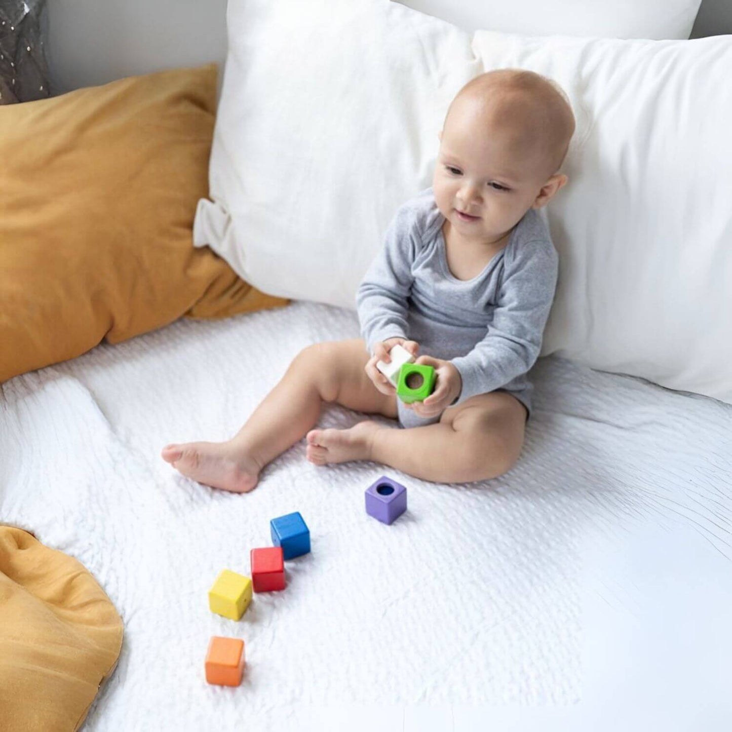 Baby Playing PlanToys Activity Blocks