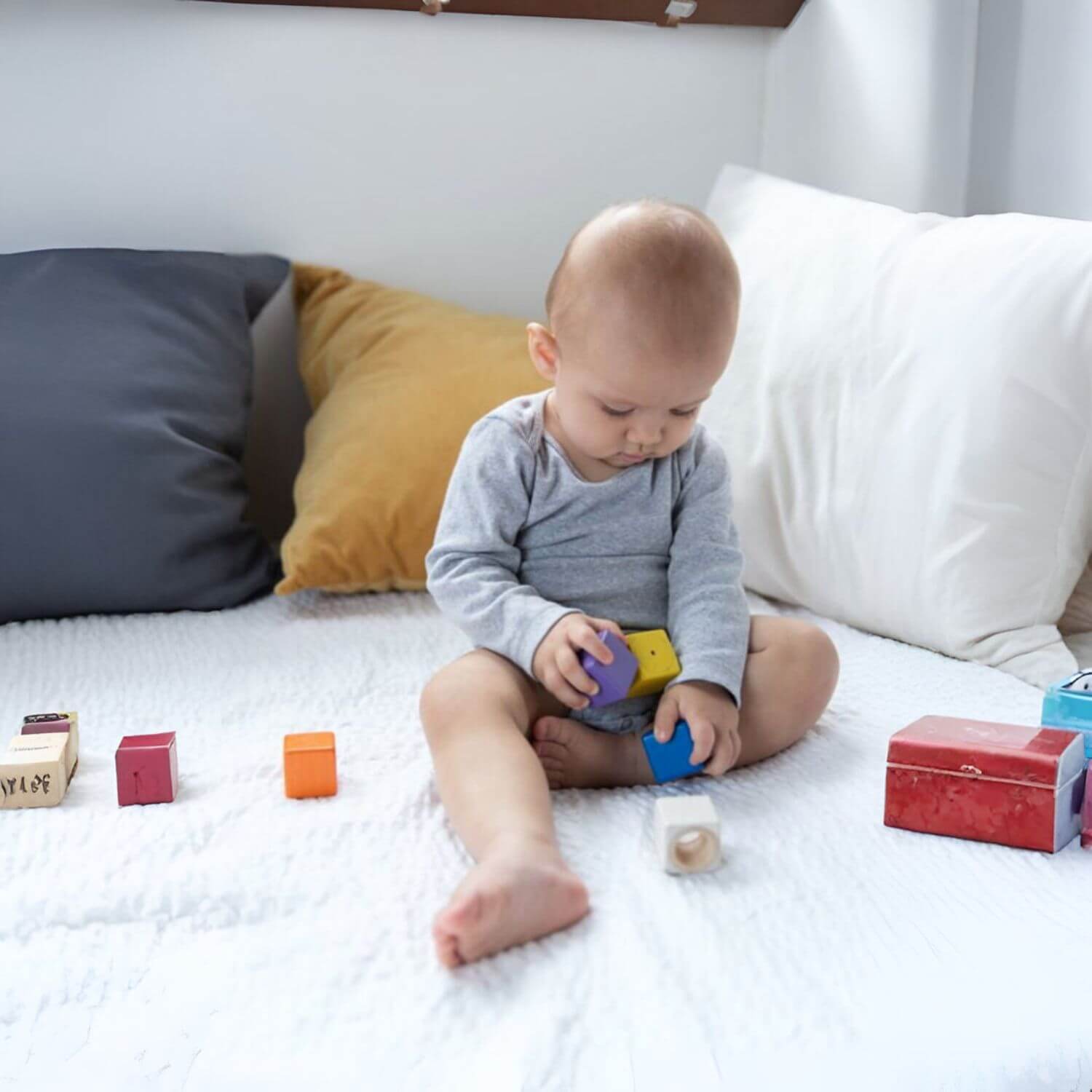 Baby Playing PlanToys Activity Blocks