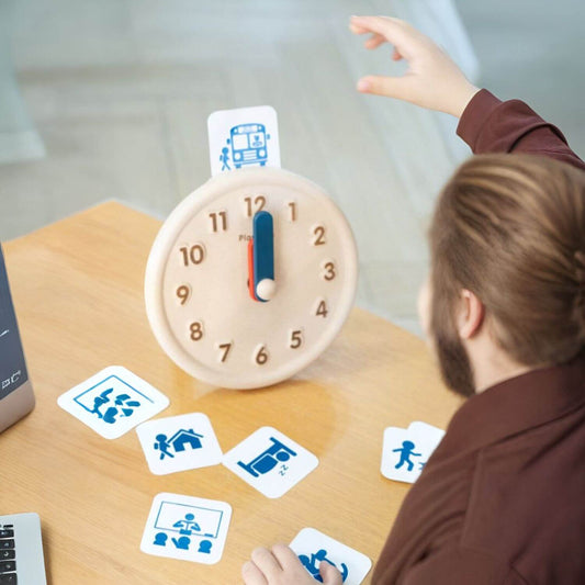 Girl Playing PlanToys Activity Clock