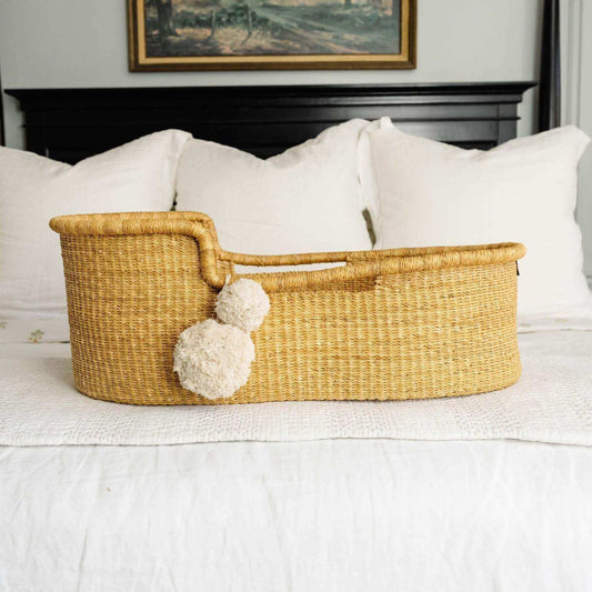 Plum+Sparrow African Moses Basket Inset Handle on bed