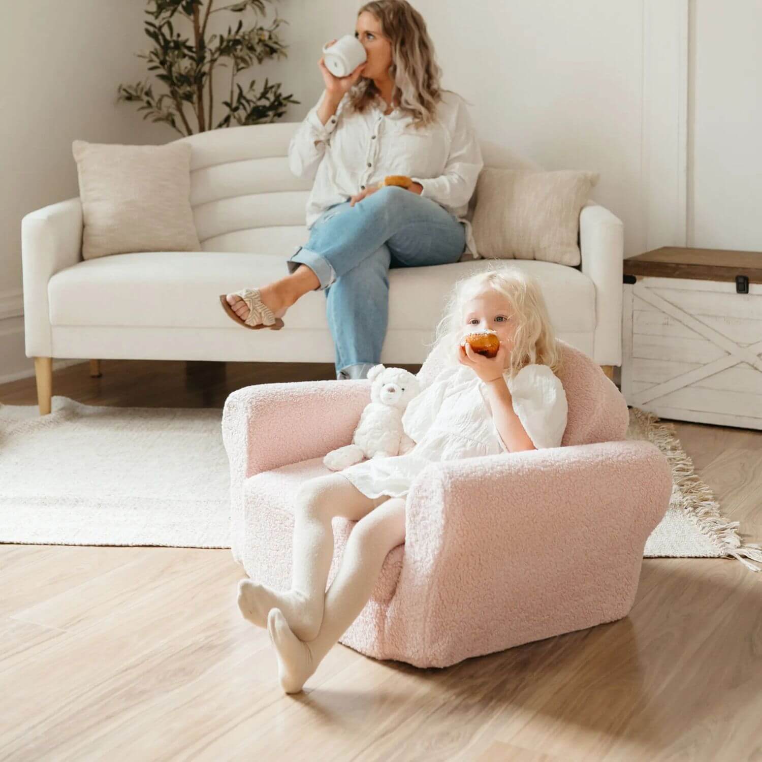 Girl Sitting on Tiny Land® Afternoon Couch —— Pink Kids Chair