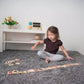 Girl Playing PlanToys Alphabet A-Z Gradient Tiles