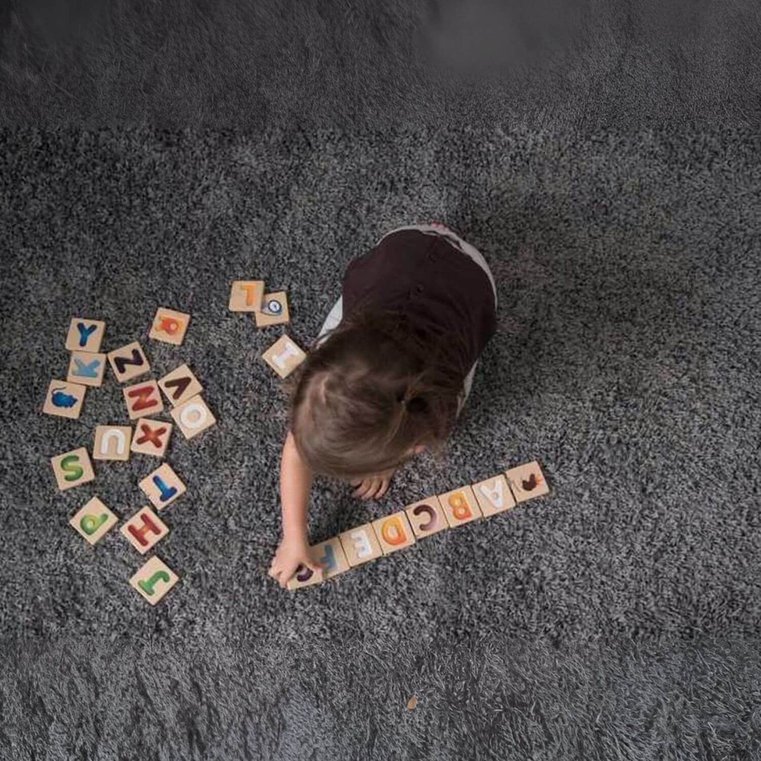 Girl Playing PlanToys Alphabet A-Z Gradient Tiles