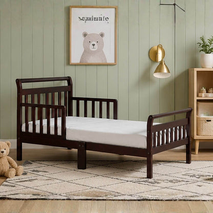 Anna Toddler Bed Espresso in a room with a teddy bear and framed picture on the wall.