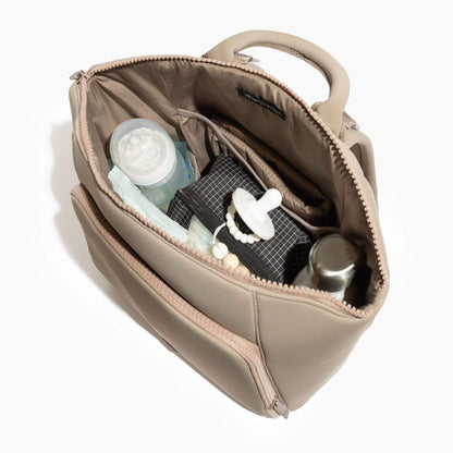 Freshly Picked Aspen Seoul Neoprene Backpack II with baby items including a bottle, pacifier, and bottle opener