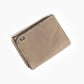 Beige blanket with a brand label on a white background