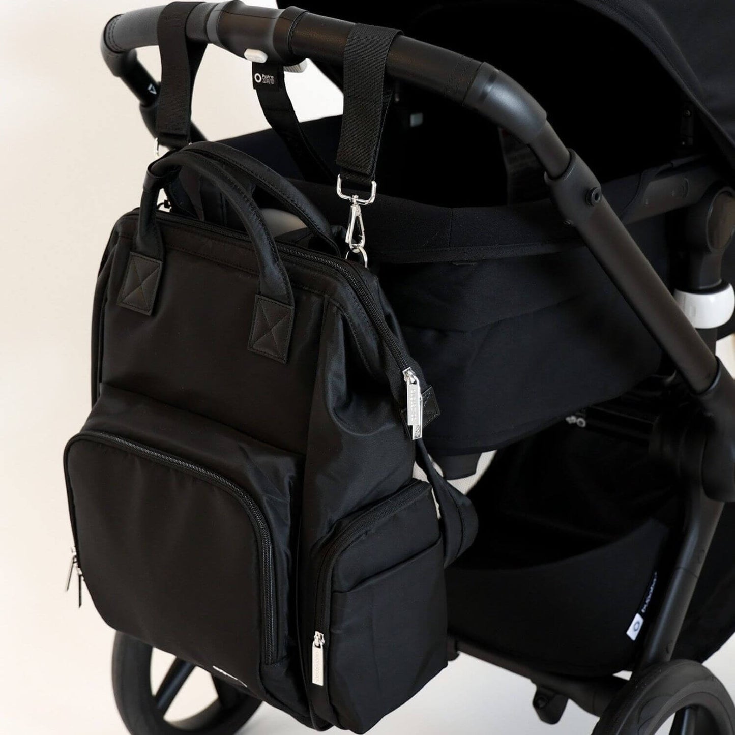 augustnoa Diaper Bag Black Attached to Stroller