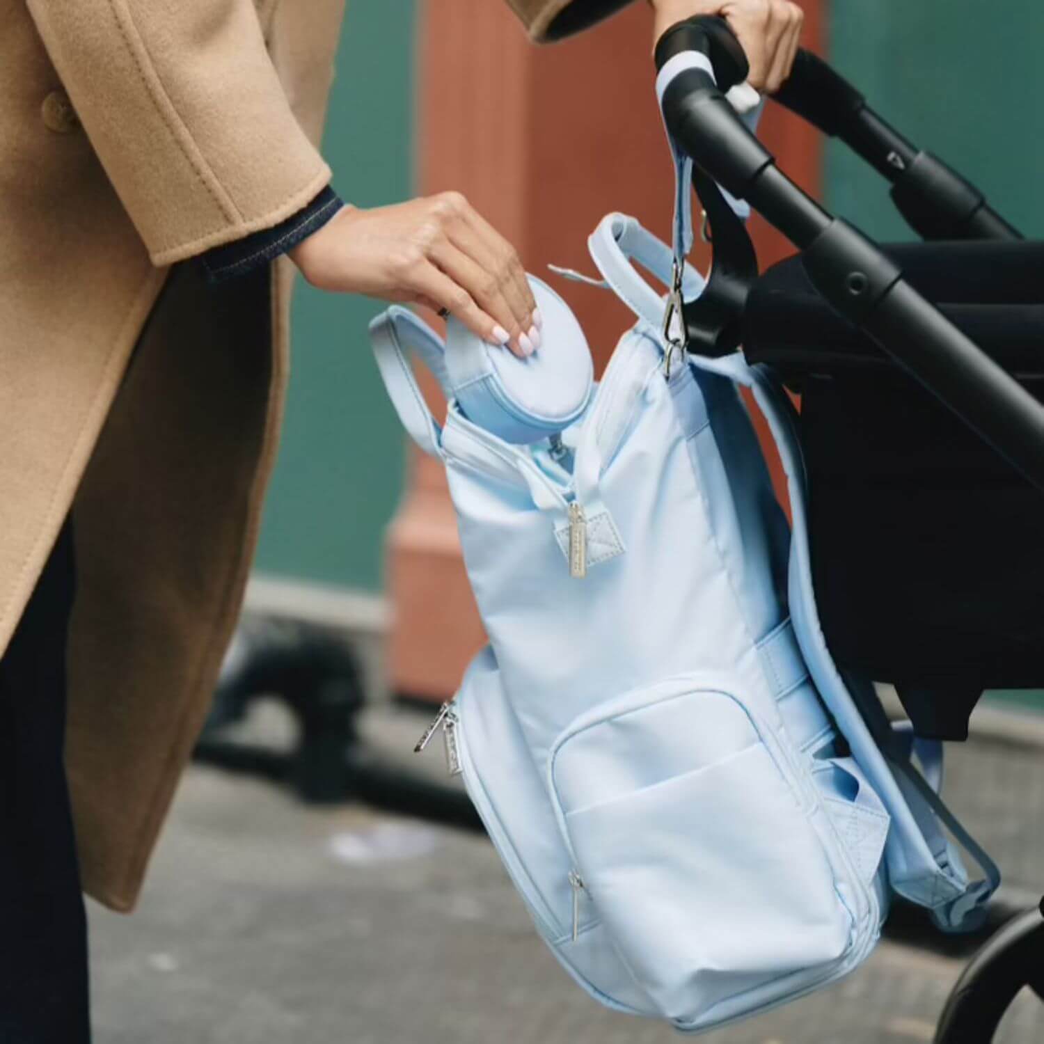 augustnoa Diaper Bag Blue Hanging on Stroller